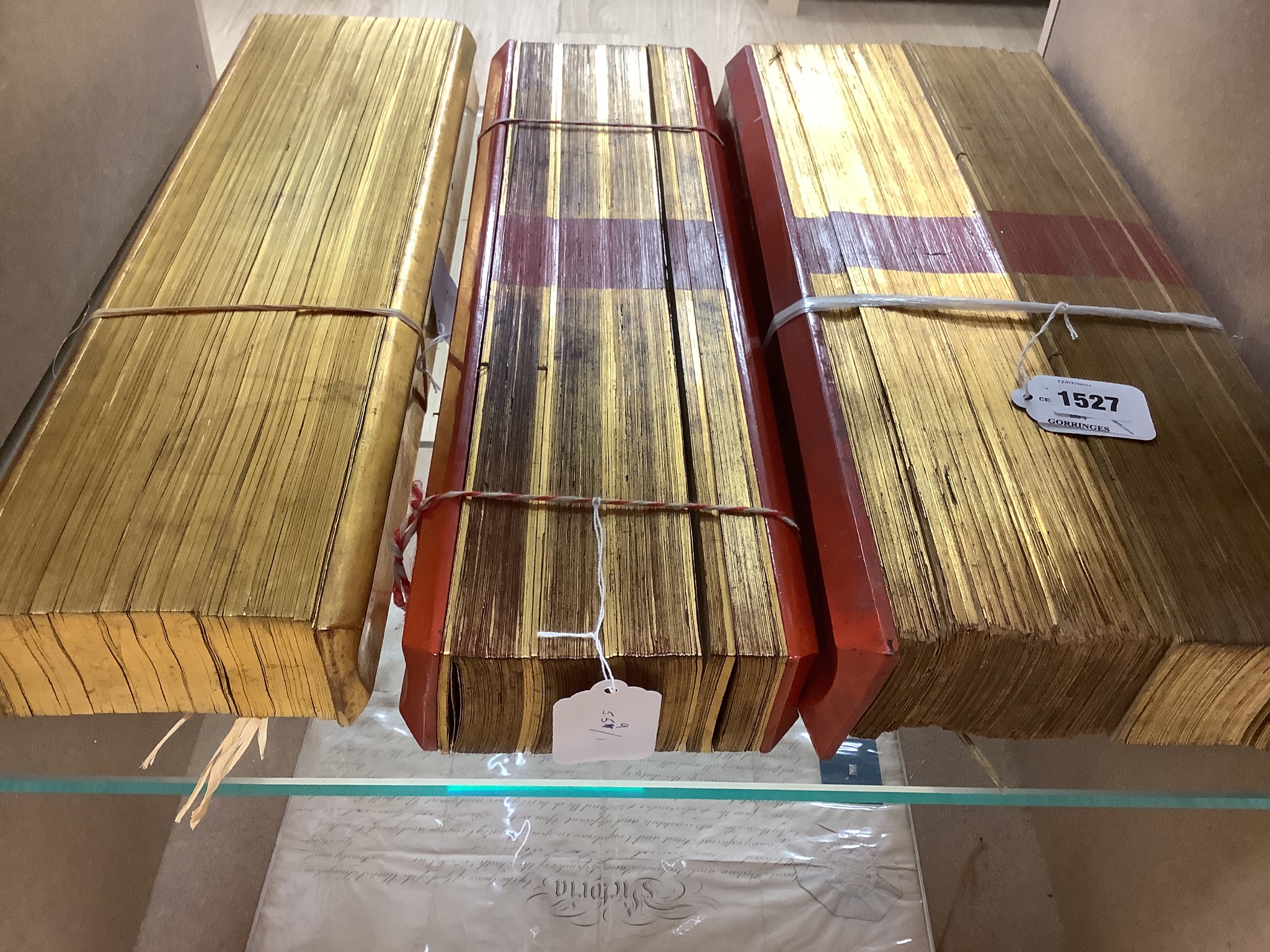 Three 19th century Burmese lacquered Sutra manuscripts, each written in Pali on bamboo leaves, gold leaf edging